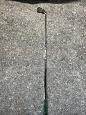Unbranded Green-Handled Chrome Golf #4 iron  .